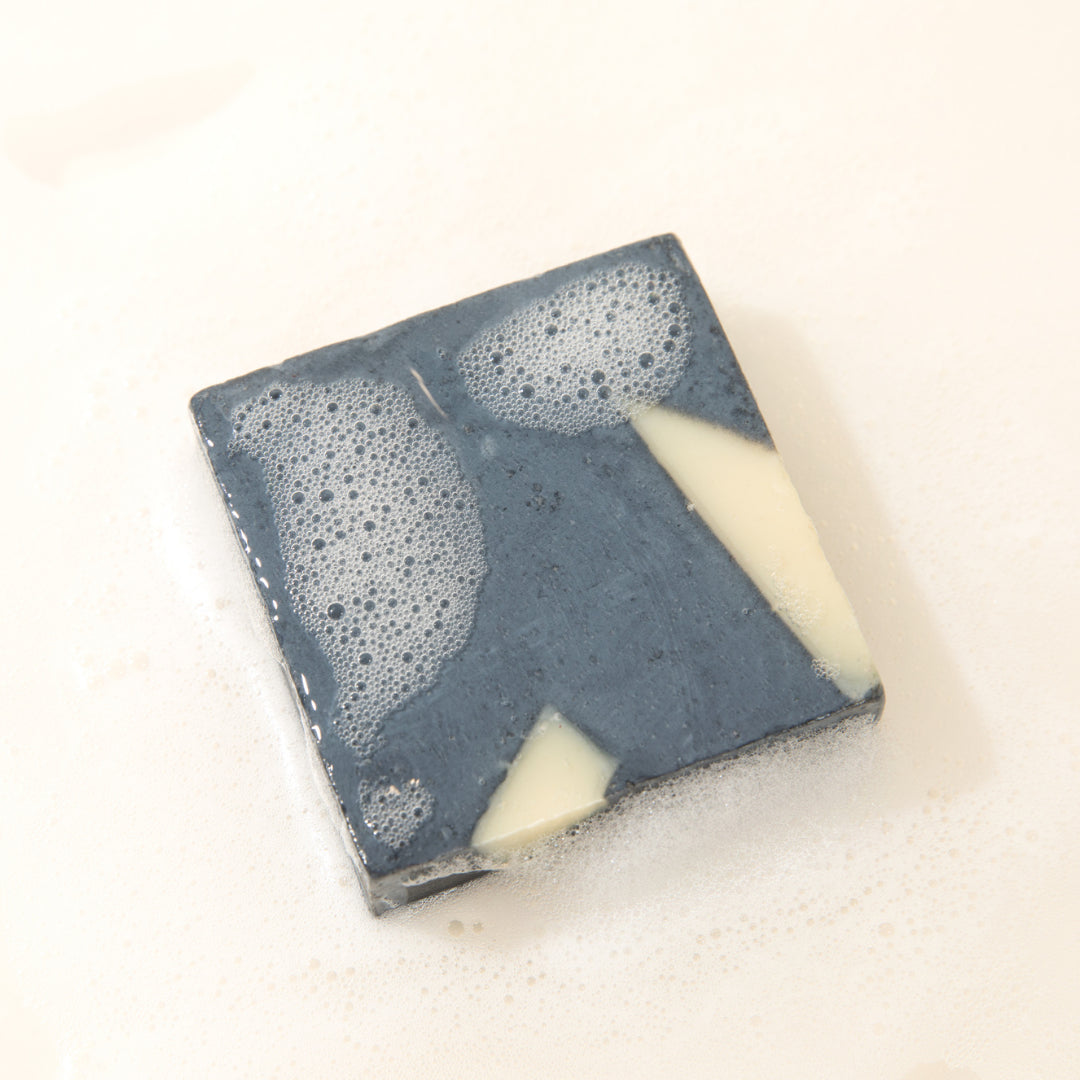 Soaperstar CBD Bath Soap in Activated Charcoal with bubbles, ideal for deep cleansing and soothing the skin.